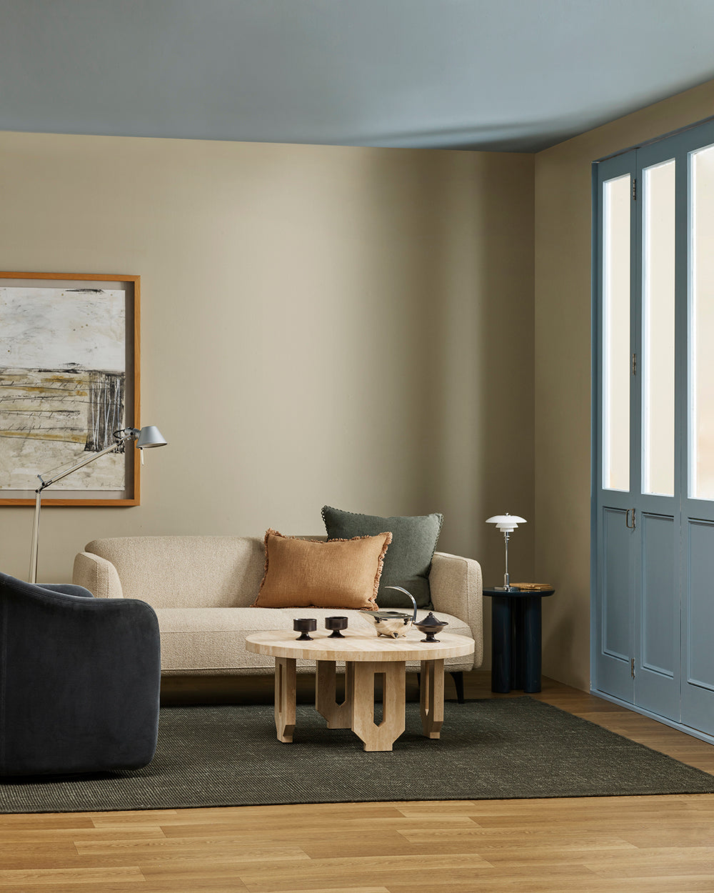 Baya Alden linen cotton blend cushion in Sage, styled on a sofa in a living room with a tan lumbar cushion