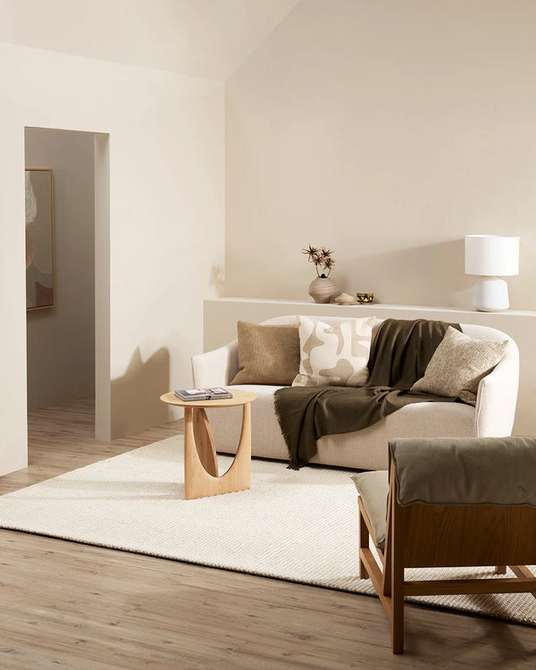 Modern living room interior featuring neutral tones and the Baya Bennet cushion