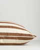 Baya Calden cotton lumbar cushion in Chestnut, side view showing its shape and edge finish