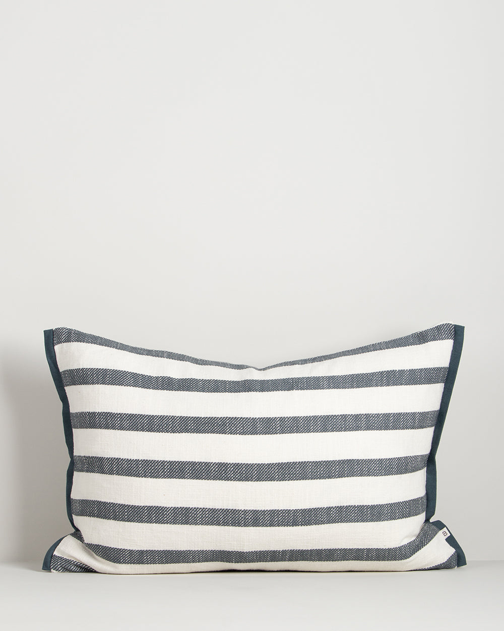 Baya Calden cotton lumbar cushion in Cloudburst on a plain background
