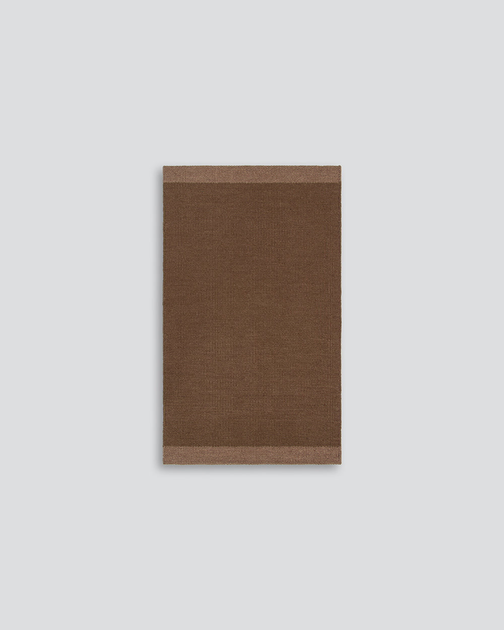 Baya Carla NZ wool floor mat in Cocoa, full flat view on a plain background.