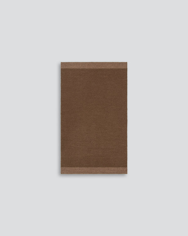 Baya Carla NZ wool floor mat in Cocoa, full flat view on a plain background.