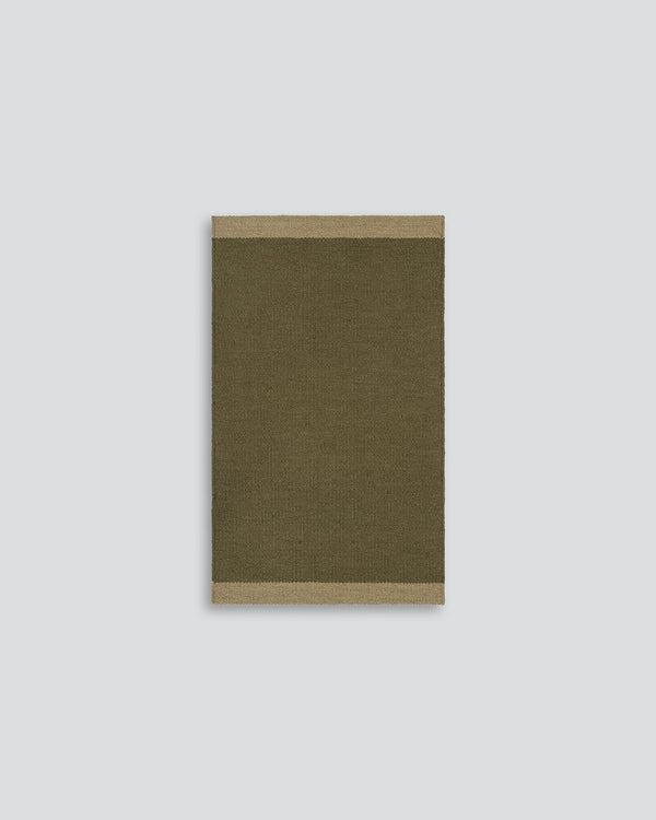 Baya Carla NZ wool floor mat in Military, full flat view on a plain background.