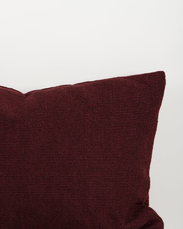 Close-up of the trim on the Baya Clipper recycled PET outdoor lumbar cushion in Claret