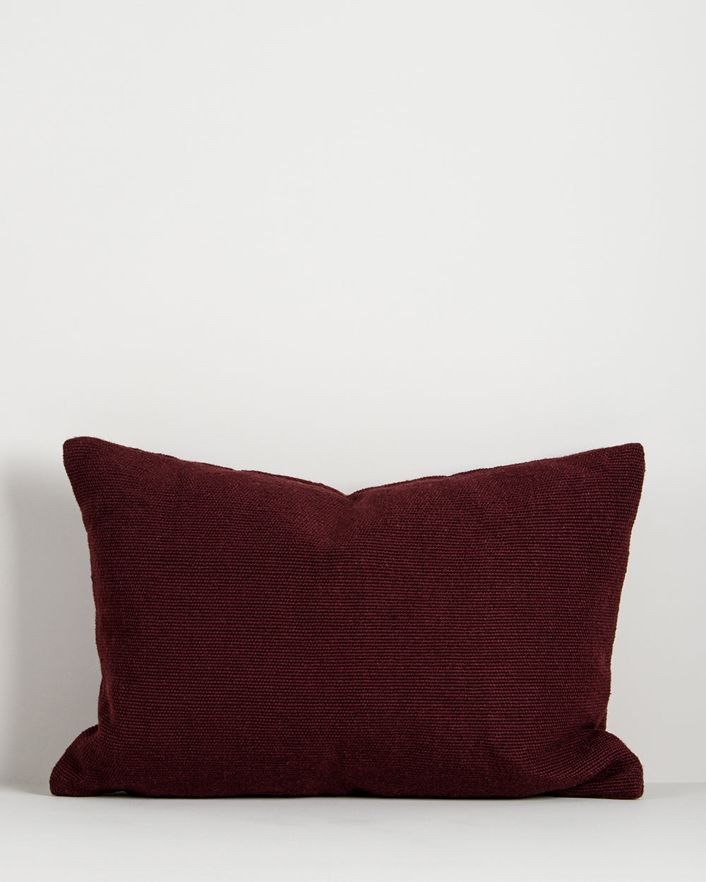 Baya Clipper recycled PET outdoor lumbar cushion in Claret, 40 x 60cm, shown on a plain background