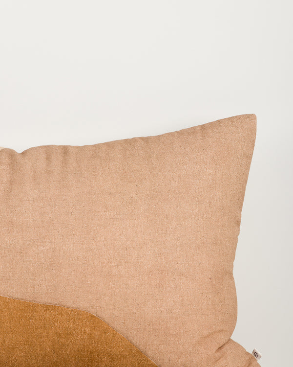 Close-up of the Baya Cortile cushion in Multi, showing the quilted stitching and colour-block seams.