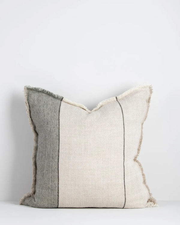 A natural linen cushion with sage green stripe and fringed edge detail
