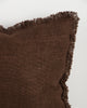 Close detail of the Dover Chocolate cushion's hand-finished fringe trim and woven texture