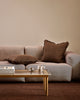 Baya Dover Chocolate cushion styled on a neutral grey sofa, shown with a smaller lumbar cushion