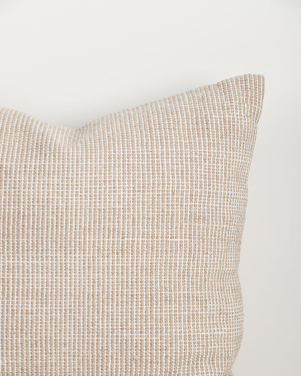 Close-up of the corner and weave texture on the Baya Dune outdoor cushion in Almond