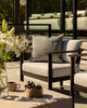 Baya Dune outdoor cushion in Eucalyptus styled alone on an outdoor armchair