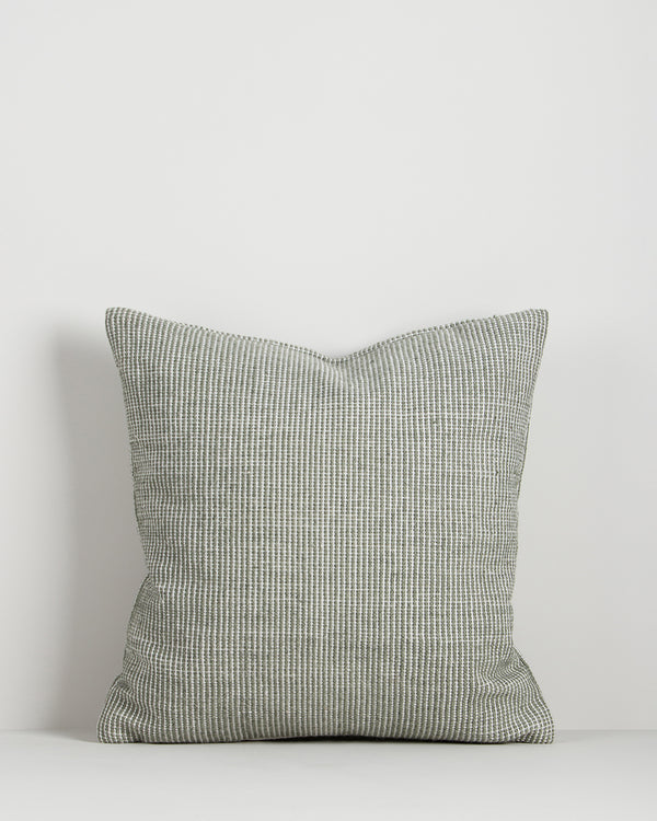 Baya Dune outdoor cushion in Eucalyptus, front view on a plain background, showing the handwoven bi-colour texture