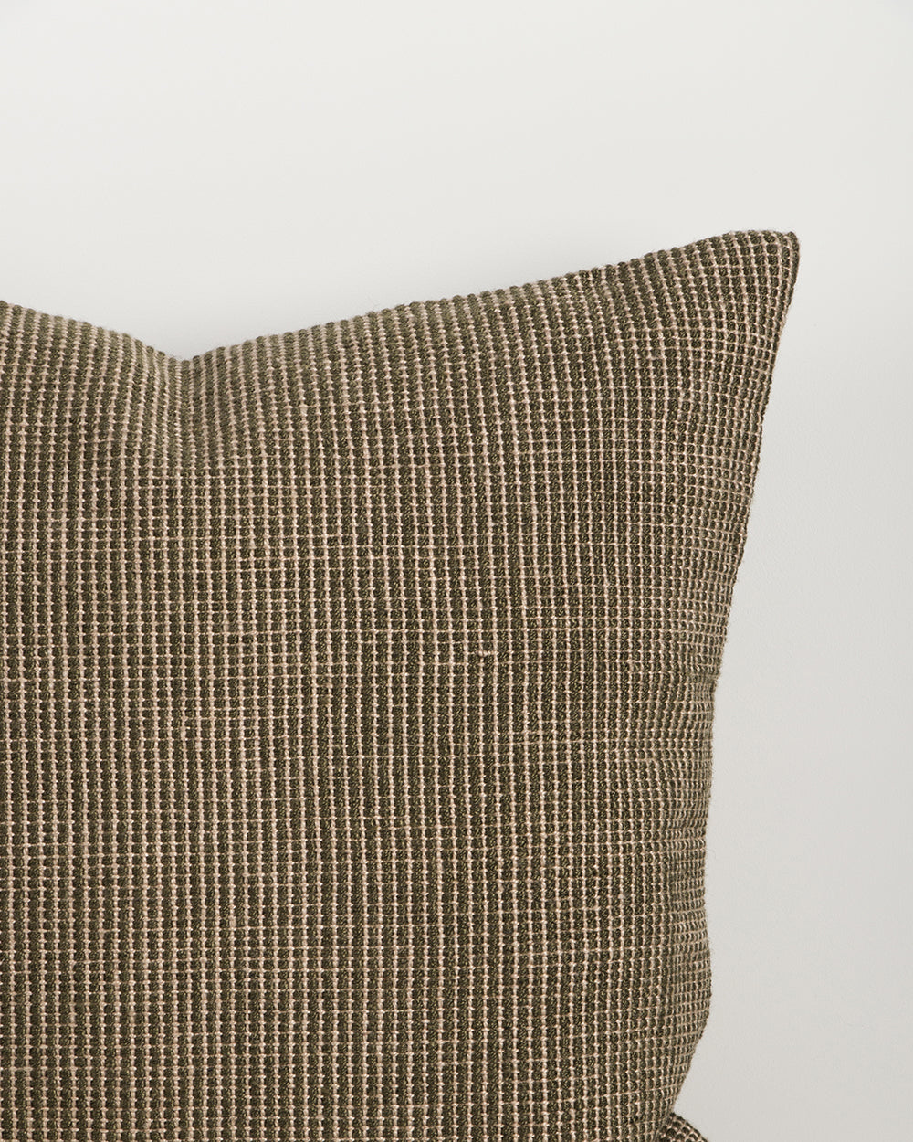 Close-up of the corner and weave texture on the Baya Dune outdoor cushion in Mangrove