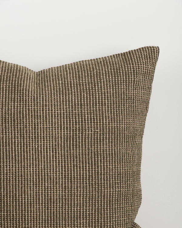 Close-up of the corner and weave texture on the Baya Dune outdoor cushion in Mangrove