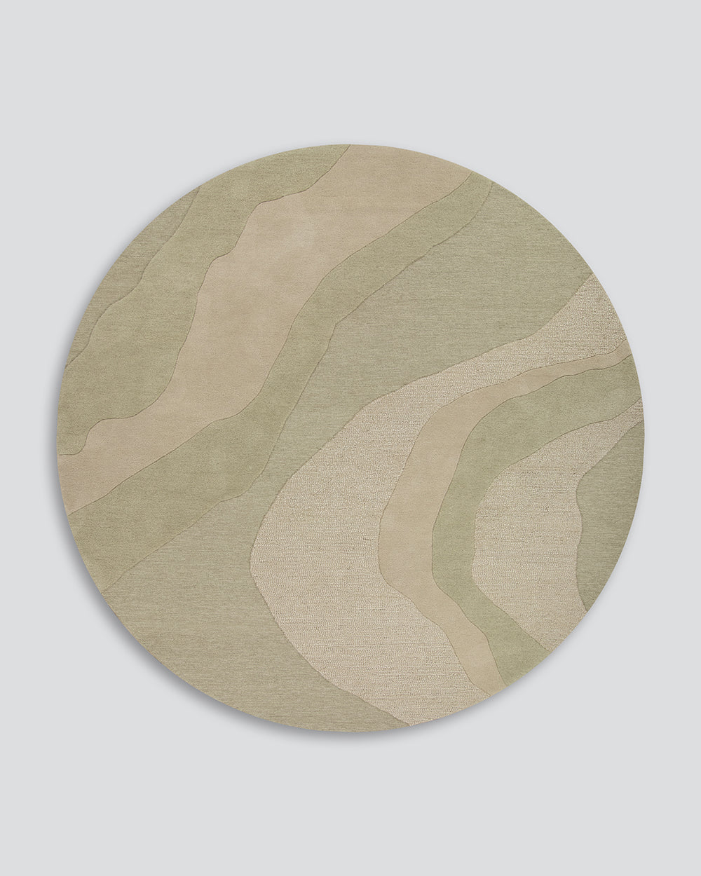 Baya Edgewater NZ wool floor rug in Pistachio, round, full view on a plain background, showing the soft wave pattern in sage and cream.