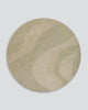 Baya Edgewater NZ wool floor rug in Pistachio, round, full view on a plain background, showing the soft wave pattern in sage and cream.