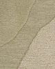 Baya Edgewater NZ wool floor rug in Pistachio, round, close view of the wave pattern showing cut pile beside textured looped pile.