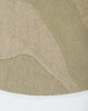 Baya Edgewater NZ wool floor rug in Pistachio, round, close view of the cut and looped pile where the wave pattern meets the edge.