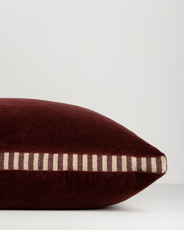 Baya Edward cotton velvet box cushion in Oxblood, side view showing the striped linen and cotton gusset