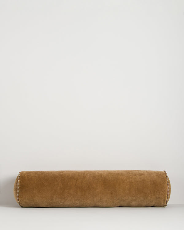 Baya Elliot cotton velvet bolster cushion in Butterscotch on a plain background