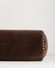Baya Elliot cotton velvet bolster cushion in Chocolate, close view of the velvet texture and striped piped end