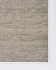 Baya Fairmont NZ Wool Floor Rug in Ash, close view of a folded corner showing the flatweave