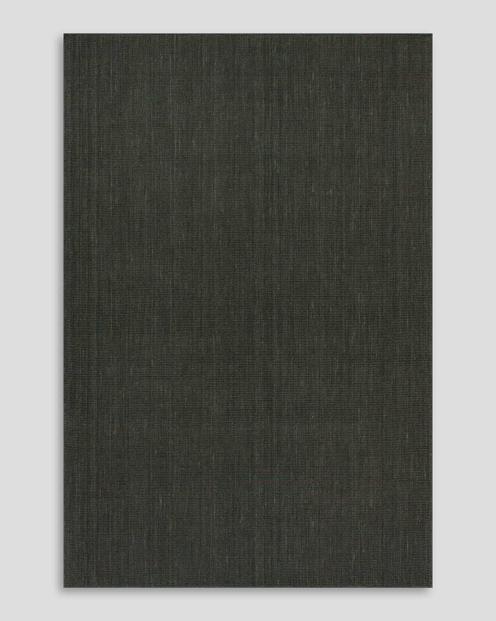 The Baya Linden Floor Rug in Petrol, a handwoven flatweave rug in a deep, dark green-toned wool, shown flat against a plain background.