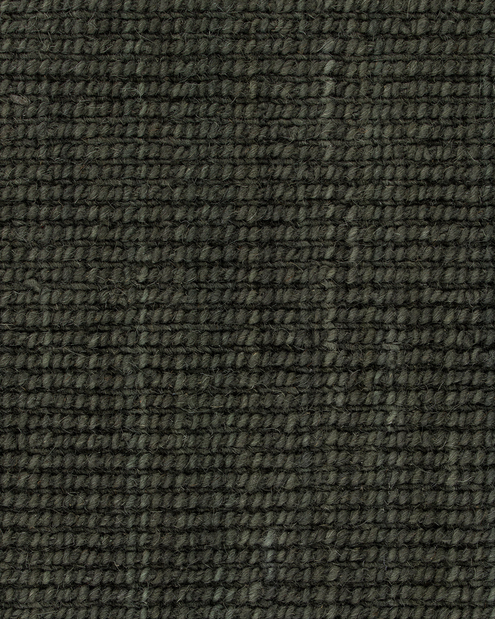 Close-up of the Baya Linden Floor Rug in Petrol showing its dense flatweave texture in a deep, dark green-toned wool.