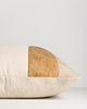 Baya Piazza Cushion in Multi, side profile lying flat, showing the ochre panel and natural linen back.