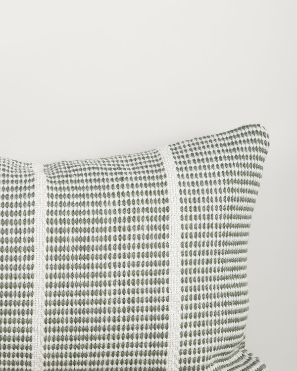 Close-up of the corner and weave texture on the Baya Shore outdoor lumbar cushion in Eucalyptus