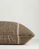 Close-up of the end seam and weave on the Baya Shore outdoor lumbar cushion in Mangrove