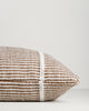 Close-up of the end seam and weave on the Baya Shore outdoor lumbar cushion in Tobacco