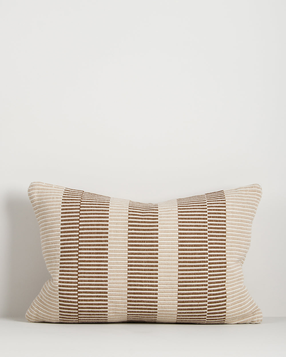 Baya Solar Outdoor Lumbar Cushion in Chocolate on a plain background, showing the brown and cream stripe weave.