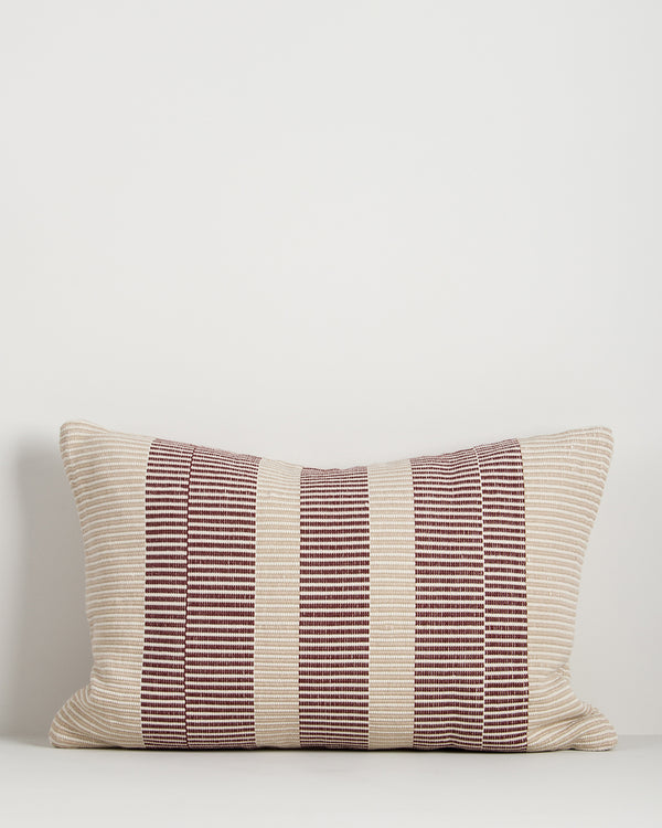 Baya Solar Outdoor Lumbar Cushion in Claret on a plain background, showing the linework weave.