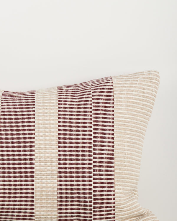 Baya Solar Outdoor Lumbar Cushion in Claret, close view of the woven linework texture.
