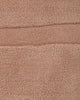 Baya Strata NZ wool floor rug in Clay, close view of the pile and a horizontal ridged line.