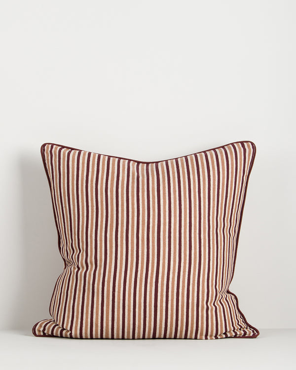 Baya Strato Cushion in Oxblood, front view on a plain background, showing the burgundy, tan and cream stripes.