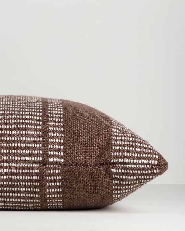 Baya Swell Outdoor Cushion in Chocolate, close view of the side gusset and stripe weave.