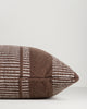 Baya Swell Outdoor Cushion in Chocolate, close view of the side gusset and stripe weave.