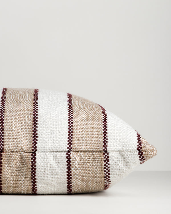 Baya Tidal Outdoor Cushion in Terracotta, close view of the side gusset and stripe weave.