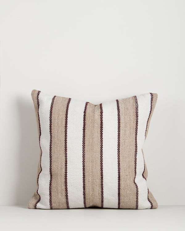 Baya Tidal Outdoor Cushion in Terracotta on a plain background, showing the camel stripe and deep red pinstripe weave.