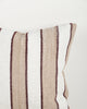 Baya Tidal Outdoor Cushion in Terracotta, close view of the woven texture in camel, ecru and deep red tones.