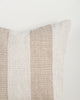 Close-up of the Baya Tide Outdoor Cushion in Almond, showing the woven linework stripe and piped edge.