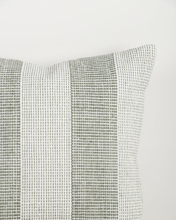 Close-up of the Baya Tide Outdoor Cushion in Eucalyptus, showing the woven linework stripe and piped edge.