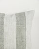Close-up of the Baya Tide Outdoor Cushion in Eucalyptus, showing the woven linework stripe and piped edge.