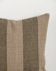 Close-up of the Baya Tide Outdoor Cushion in Mangrove, showing the woven linework stripe and piped edge.
