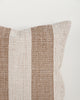 Close-up of the Baya Tide Outdoor Cushion in Tobacco, showing the woven stripe texture and piped edge.