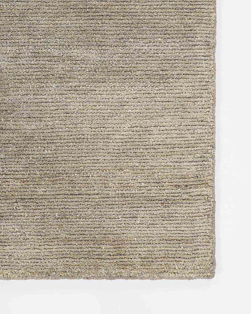 Close up of Baya NZ Anchorage rug in shade Stone, warm neutral beige. 