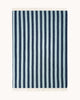 A full image of a throw blanket, spread to see the full pattern of dark blue and ice blue stripes. 