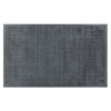 Full view of a handmade wool rug in a neutral, muted blue shade, with an indented border adding interest. 